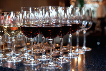 glasses with red and white wine on the table