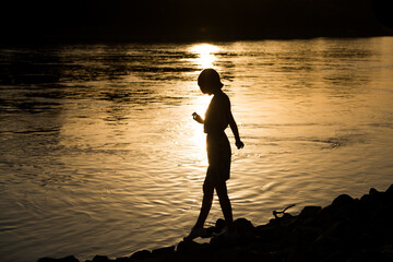 silhouette of a person on the river Rhein
