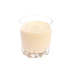 Soy milk in glass on a white background 