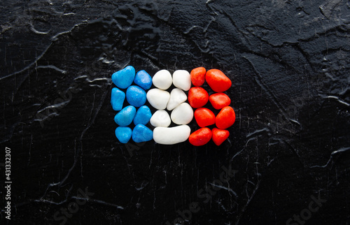 blue, red and white stones in flag colors of Usa, France, Russia patriotic background