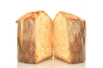 Two halves of a freshly baked Easter cupcake, macro, isolated on white.