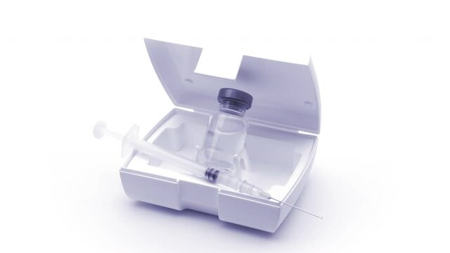 small glass bottle and syringe with the vaccine or medical supplies on a white background (looping)