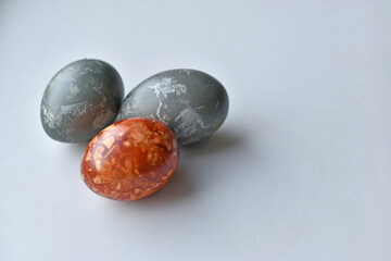 Red and blue Easter eggs on a white background