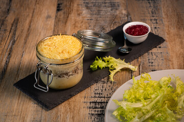 Beef pie recipe with red beet sauce cooked with chili spices and salad