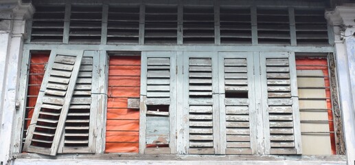 Broken down wooden window shutters in Penang, Malaysia