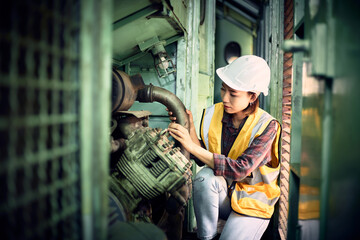 Industrial worker is maintenance the machine