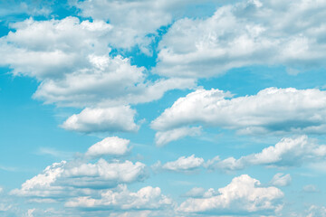 Naklejka na ściany i meble Cumulus white clouds at blue sky in spring as background