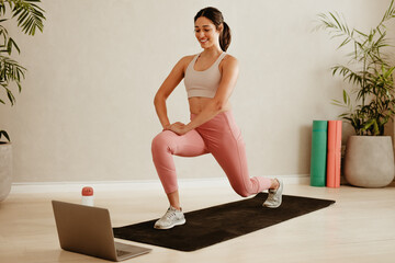 Woman exercising watching online exercise session