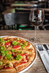 delicious pizza and wine glass