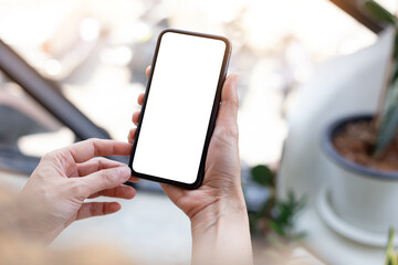cell phone blank white screen mockup.woman hand holding texting using mobile on desk at office.background empty space for advertise.work people contact marketing business,technology