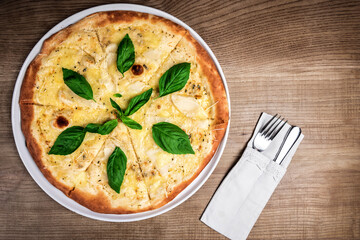 pizza with basil leaves