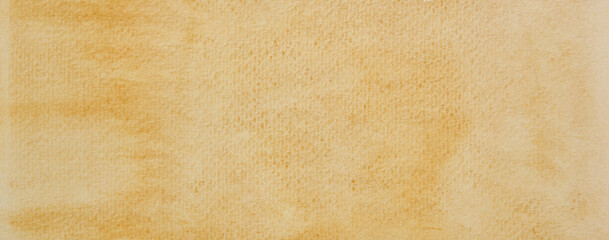 a photo image of abstract brown watercolor on paper, hand paint of brown watercolor for background,...