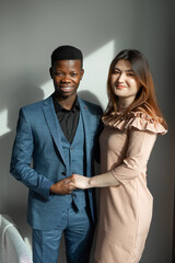 portrait of young people, african man and caucasian woman 