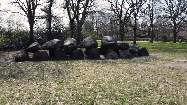 Prehistoric hunebed (dolmen, grave), Rolde, and beautiful oak tree in Drenthe (Drente), The Netherlands.