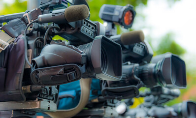 Professional tv cameras on tripods recording social event