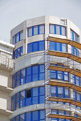 The facade of modern residential building under construction