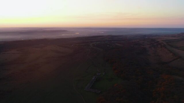 Flight in the evening over the meadow to the horizon in autumn