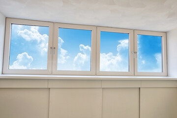 Fresh white modern dormer window with blue sky and white clouds view, New dormer, roof window in...