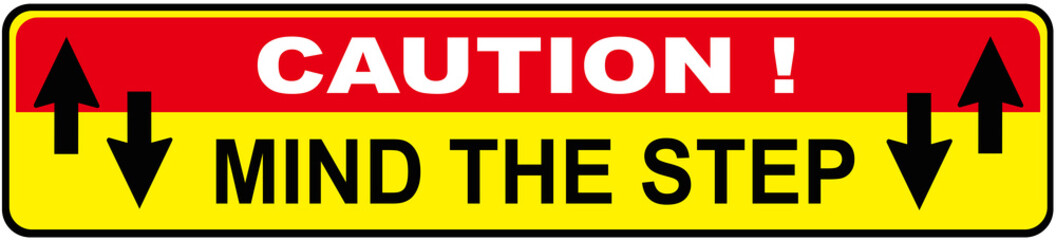 A sign that says : CAUTION MIND THE STEP