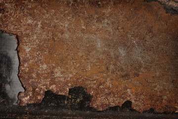 old metal with remnants of black paint, rust and scratches, grunge background