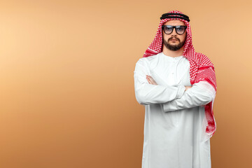 A Saudi Arab man in national dress and sunglasses. Dishdasha, kandora, thobe, islam. Copy space.