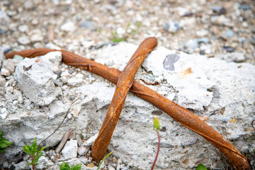 a construction steel cross on a demolished wall