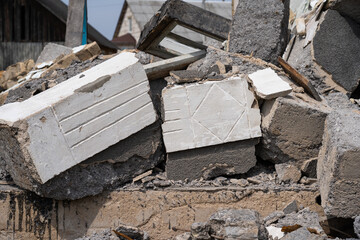 a lot of broken concrete blocks due to the demolition of the house