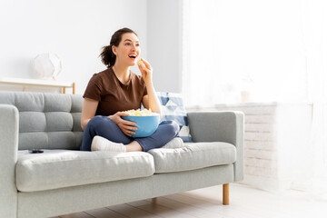 Young woman watching  TV