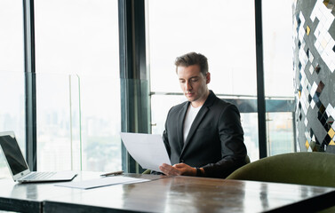 Fototapeta premium Confident business Man with smartphones in airline lounges
