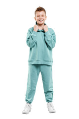 Naklejka premium boy in turquoise blue tracksuit isolated on white background.