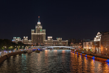 View cityscape Moscow by night. High-rise on Kotelnicheskaya embankment on Moskva-river.