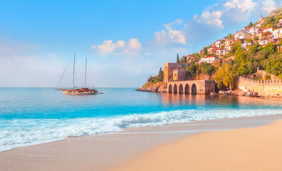 Beautiful sandy beach and soft turqoise Mediterranean sea wave - Landscape of ancient shipyard near...