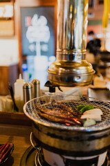 Grilling meat on a brazier