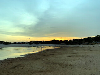Sunset on the river beach.
