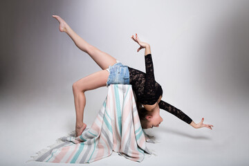 Yoga gymnastics backbend, female acrobat in graceful pose, strong flexible body of girl gymnastics...