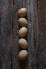Natural dye for Easter eggs - beetroot on vintage wooden background
