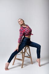 Yoga gymnastics backbend, female acrobat in graceful pose, strong flexible body of girl gymnastics on white background