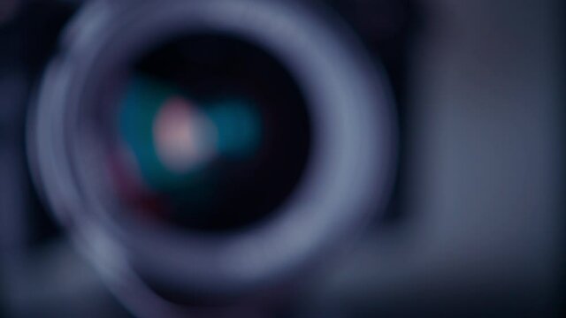 the lens of a movie camera or photo camera is shot in close-up