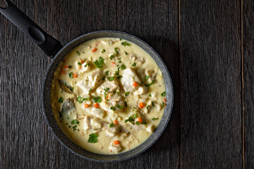 poached cod fish in milk base sauce