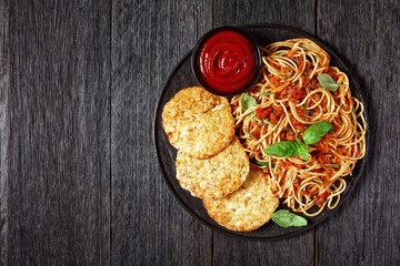 cod fish patties with pasta, top view