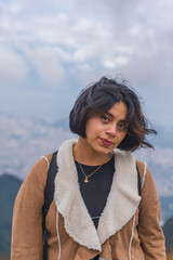 Young woman walking along a mountain path.