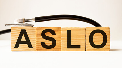 word ASLO on wooden blocks. medical concept . the medicine