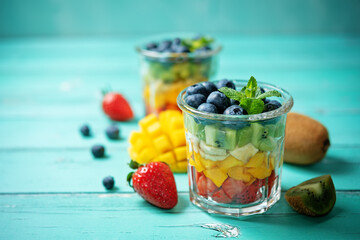 Rainbow fruit salad in a glass