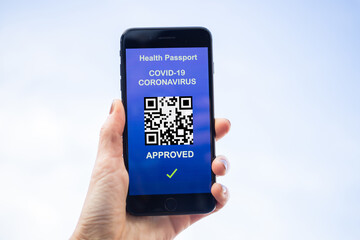 health Vaccine Passport for Coronavirus or Covid-19. Traveller Using Mobile Phone with Vaccination in Immune Status to Certificated International Traveling in Airport
