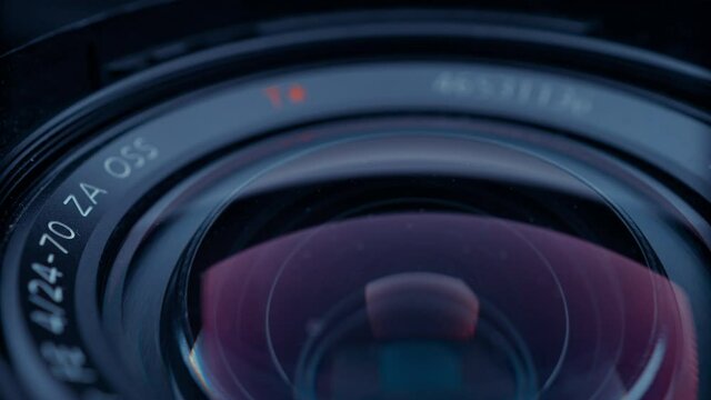 the lens of a movie camera or photo camera is shot in close-up