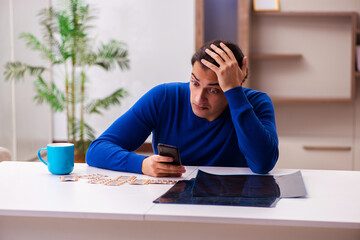 Young sick man suffering at home