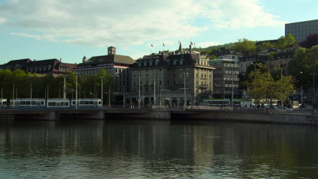 Lockdown Of Historic Buildings Along The Limmart River Near The Bahnhofbrucke Bridge, With Bright Skies And Ush Green Trees - Zurich, Switzerland