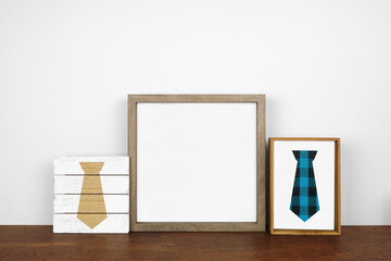 Mock up wood frame with rustic Fathers Day tie decor. Wooden shelf against a white wall. Copy space. - Powered by Adobe