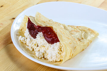 Pancake with cottage cheese and jam