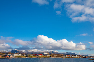 Naklejka na ściany i meble Blue sky and white clouds in Salhussundet , Brønnøy municipality, ,Helgeland,Nordland county,Norway,scandinavia,Europe